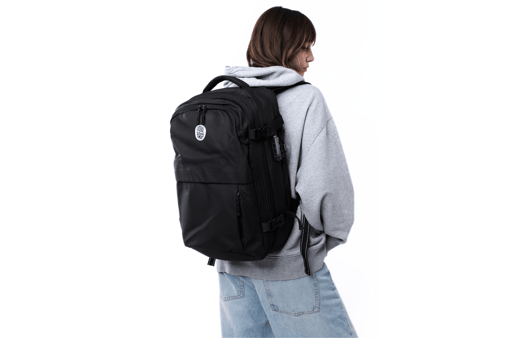 Person wearing MOVO BAGS vacuum compression travel backpack